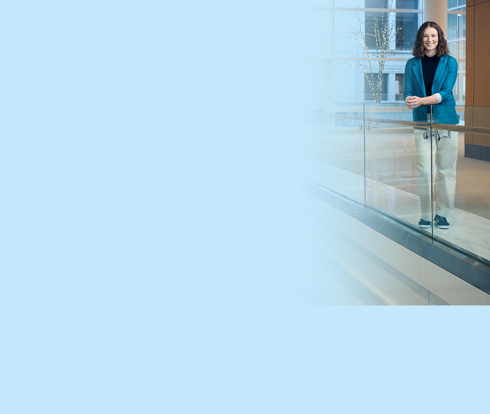 a person standing on a glass railing