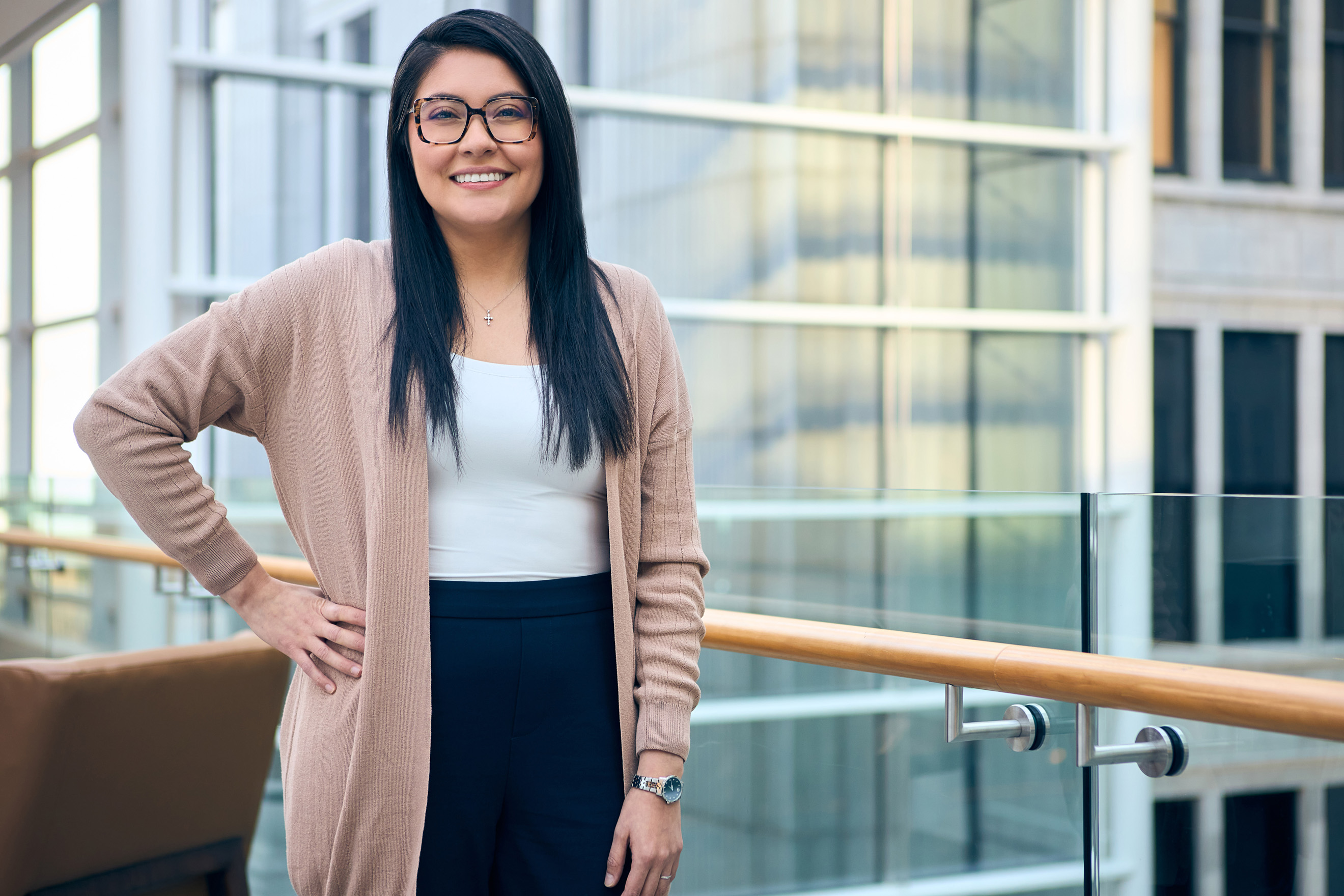 a person smiling with her hand on her hip