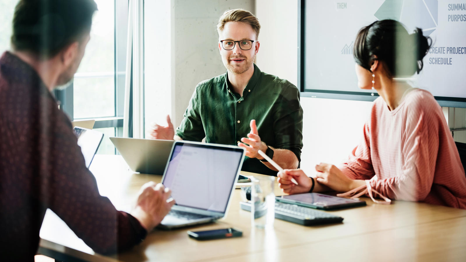 a group of people sitting around a table