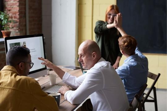 a group of people sitting at a table
