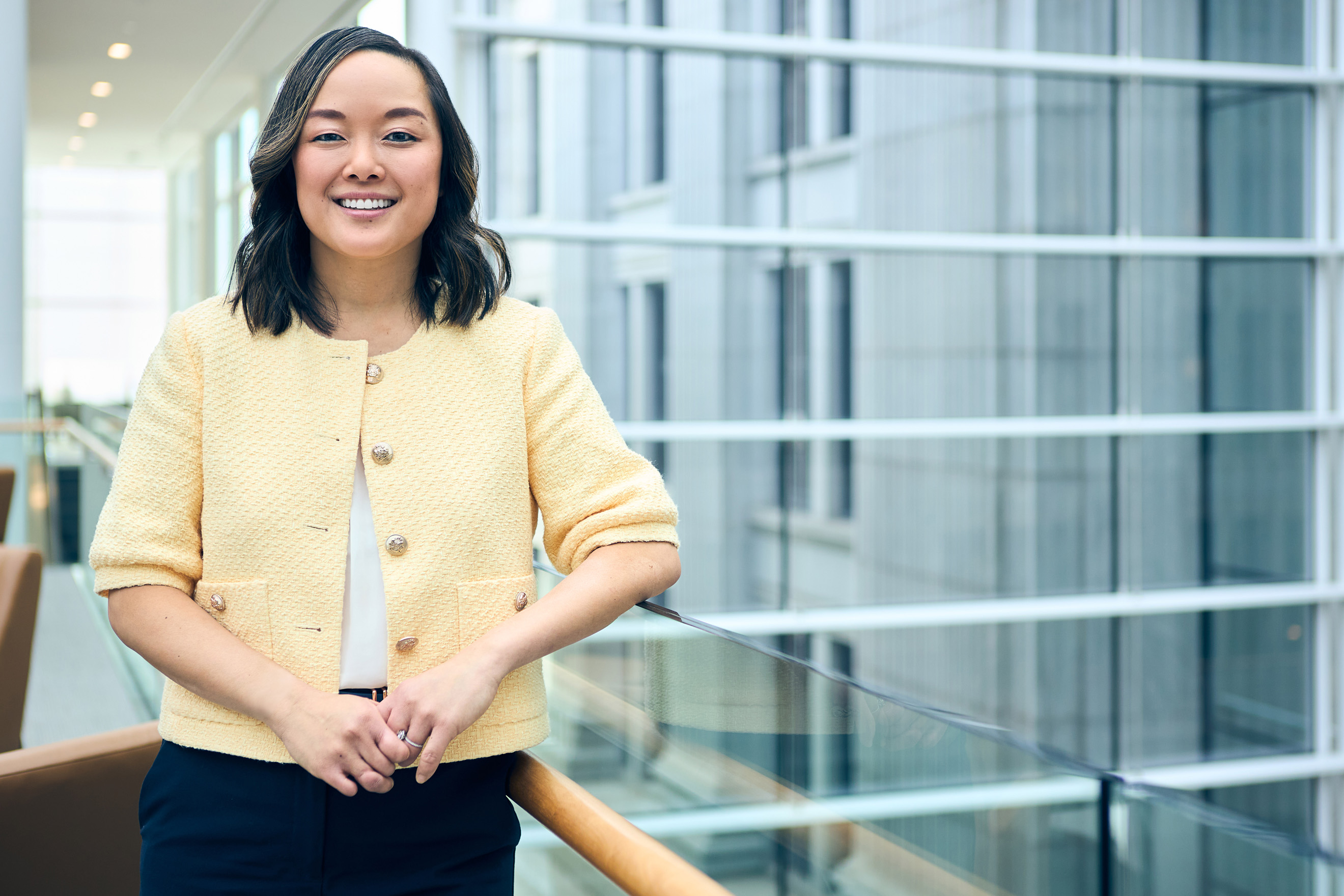 a person standing next to a railing