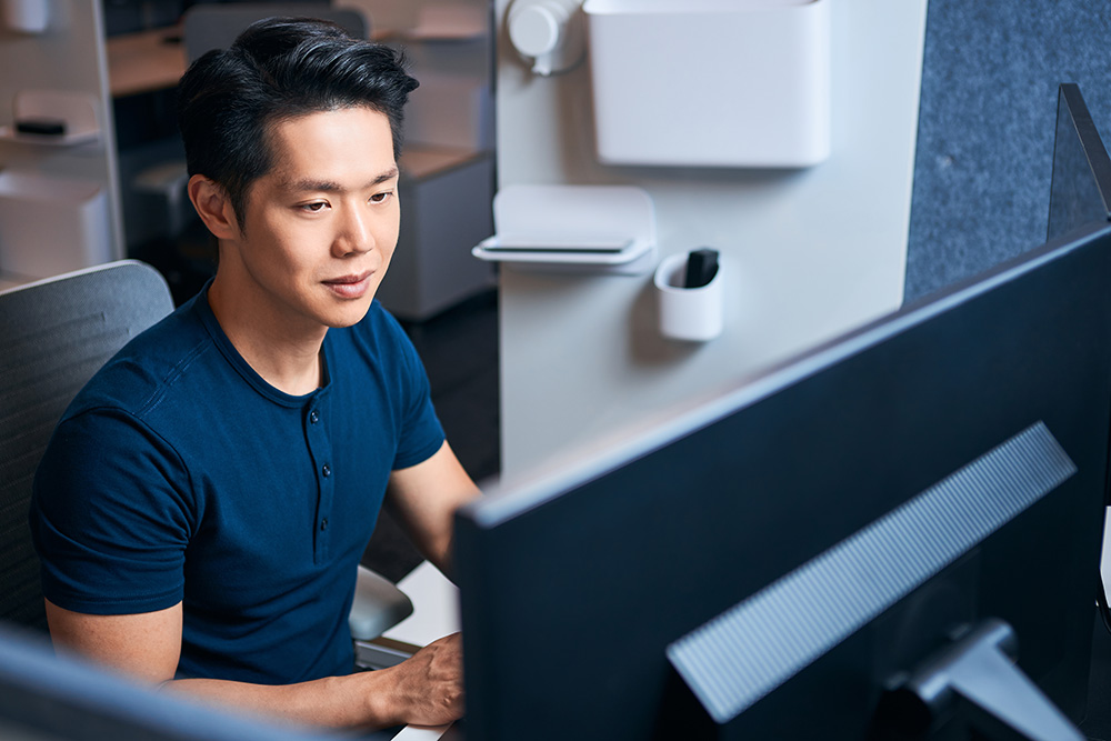 a person sitting at a computer