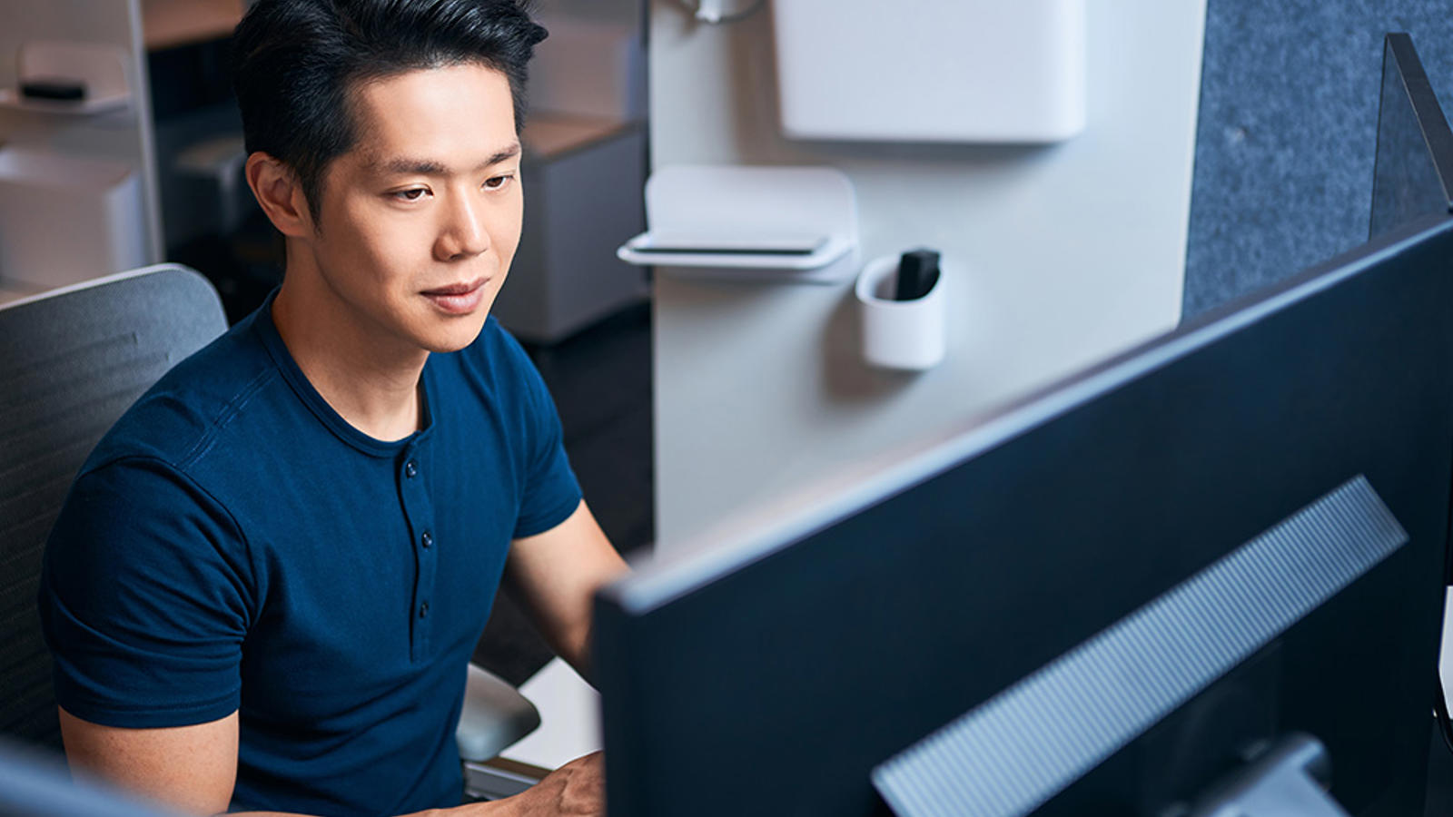 a person sitting at a computer
