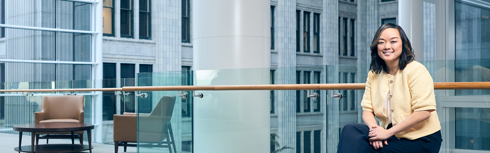 a white pillar with a wooden railing