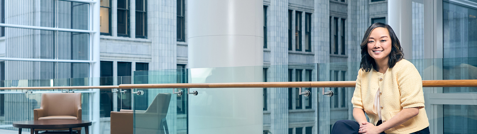 a white pillar with a wooden railing