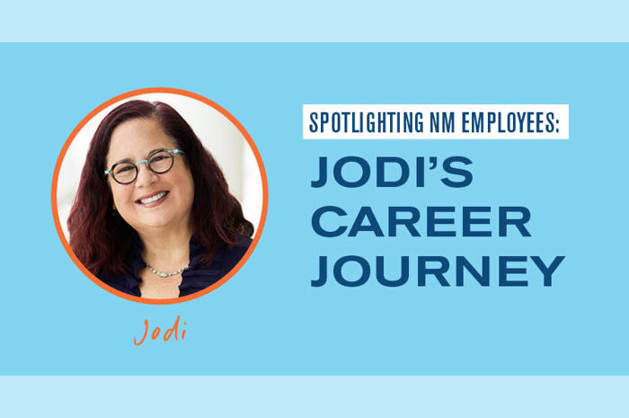 a person with glasses smiling