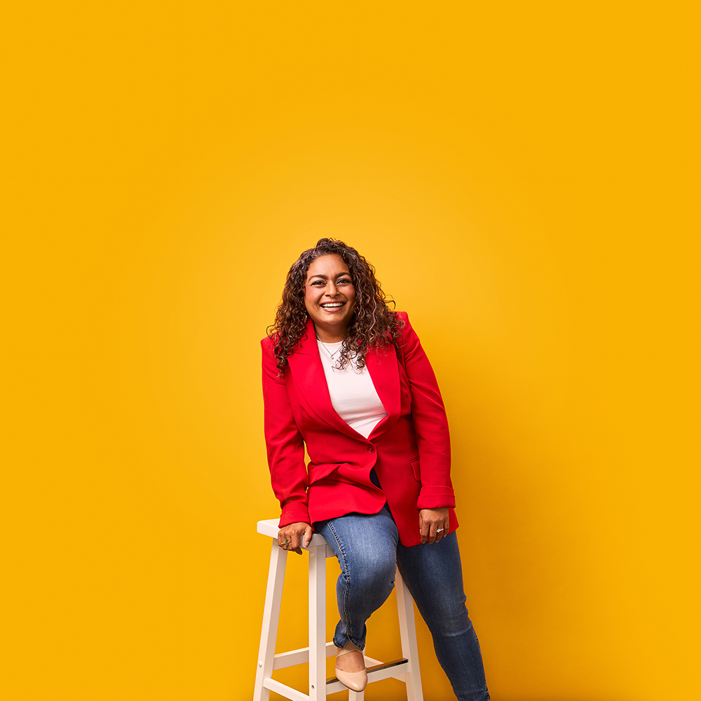 a person sitting on a stool