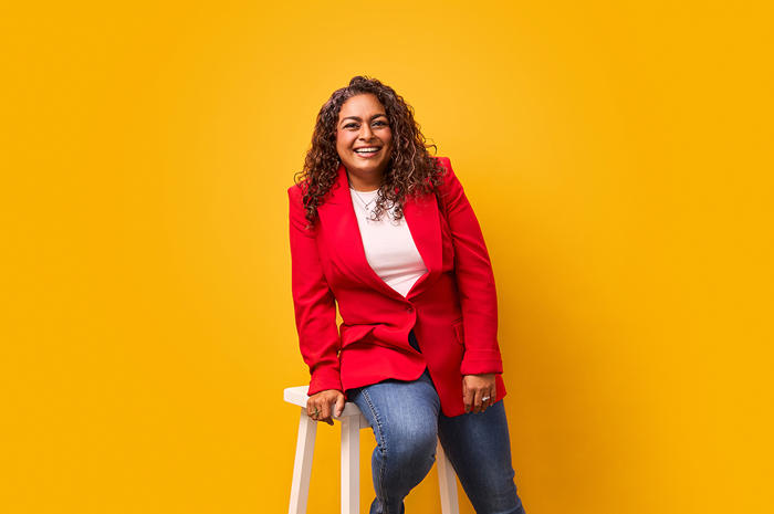 a person sitting on a stool