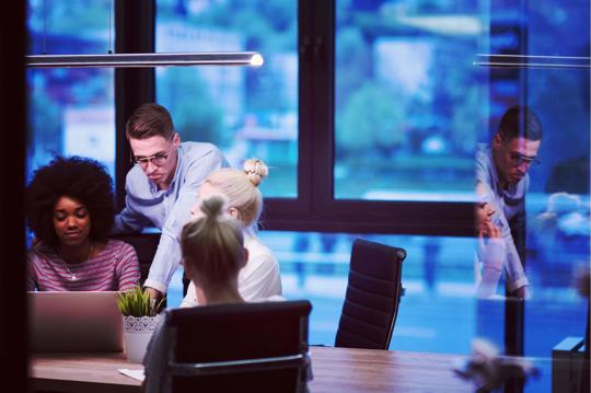 a group of people in an office